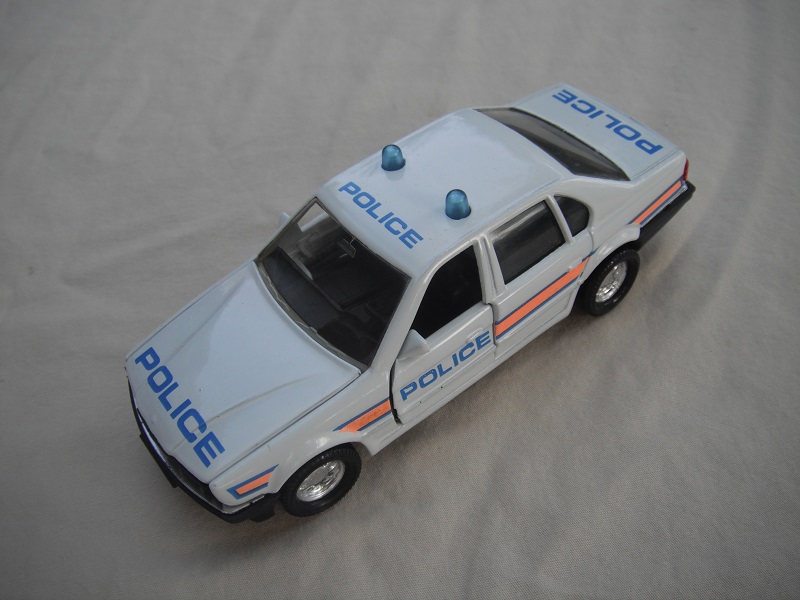 4. White body/black base/China/clear windows/black int/lt.blue dome lights/Police &amp; orange stripe.