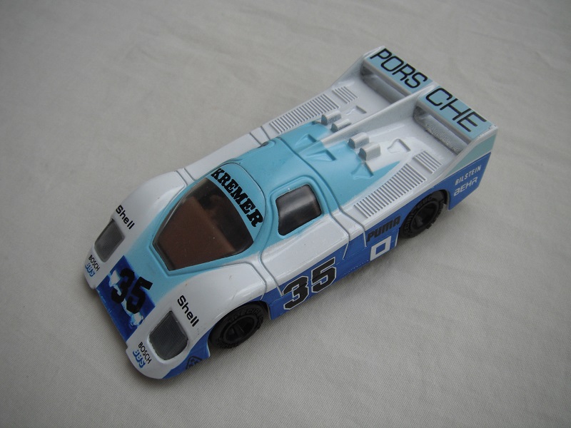 14.White, light &amp; dark blue body/black base/China/clear windows/dk.brown interior/unchromed wheels/Porsche Kremer #35.