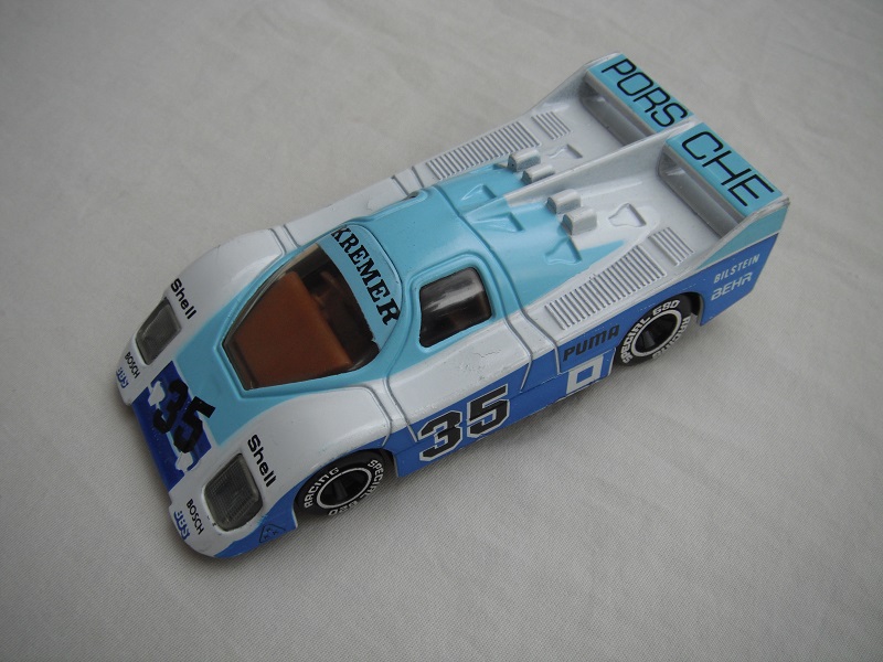 13.White, light &amp; dark blue body/black base/Macau/clear windows/lt.brown interior/chromed lettering on wheels/Porsche Kremer #35.