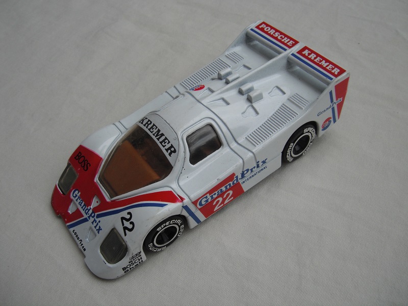 12.White &amp; dark red body/black base/Macau/clear windows/dk.brown interior/chromed lettering on wheels/Kremer Grand-Prix #22.