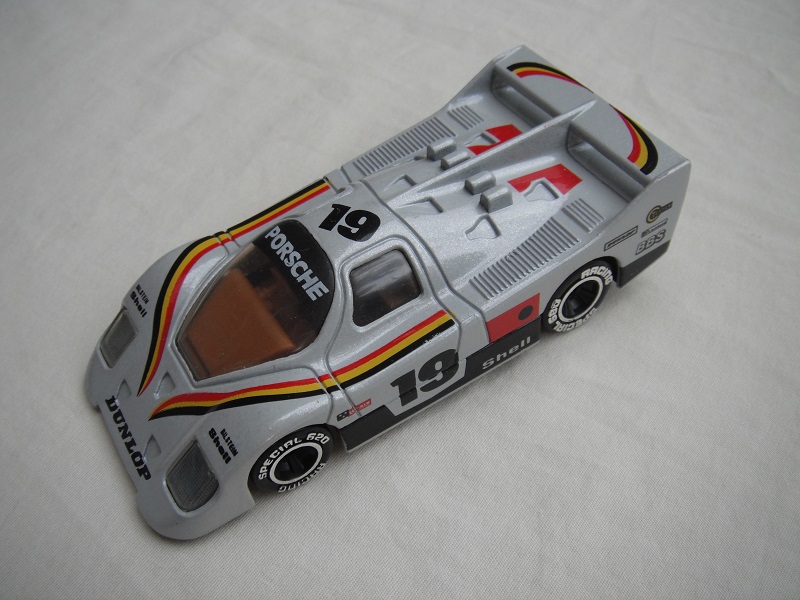 8. Pearly silver body/black base/Macau/clear windows/brown interior/chromed lettering on wheels/Porsche #19.