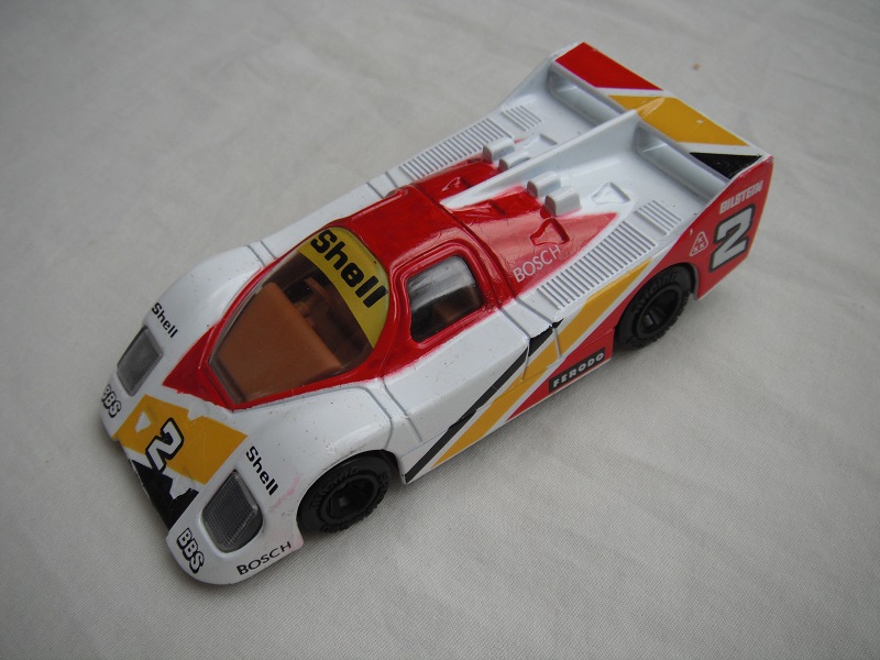 5. White, dk.red &amp; dark yellow body/black base China/clear windows/lt.brown interior/unchromed wheels/Shell #2.