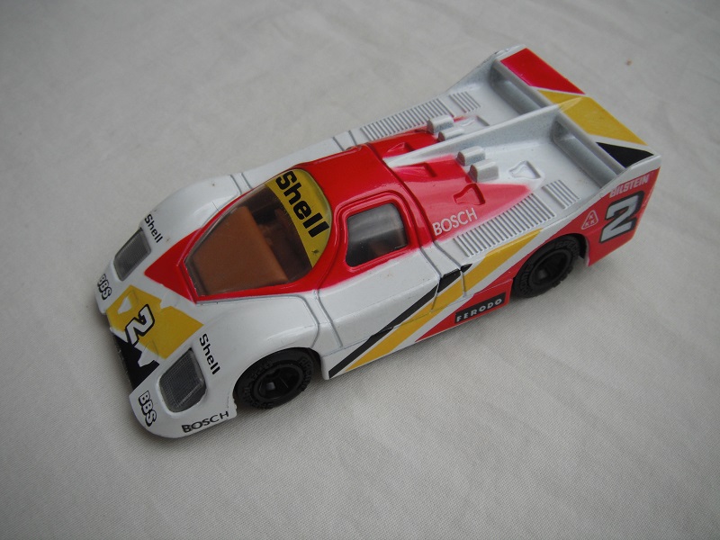 4. White, red &amp; yellow body/black base China/clear windows/lt.brown interior/unchromed wheels/Shell #2.