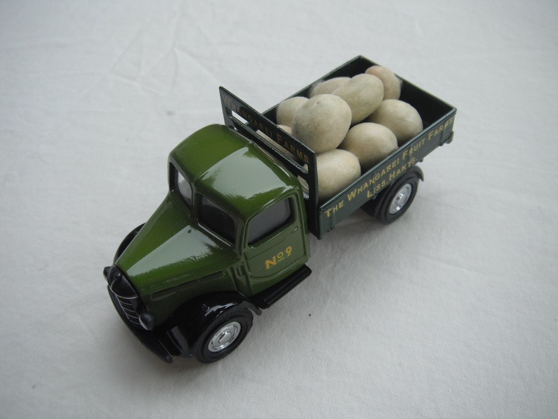 8.  Light green cab/dark green bed/black base/Y63 China/load of melons/No.9.