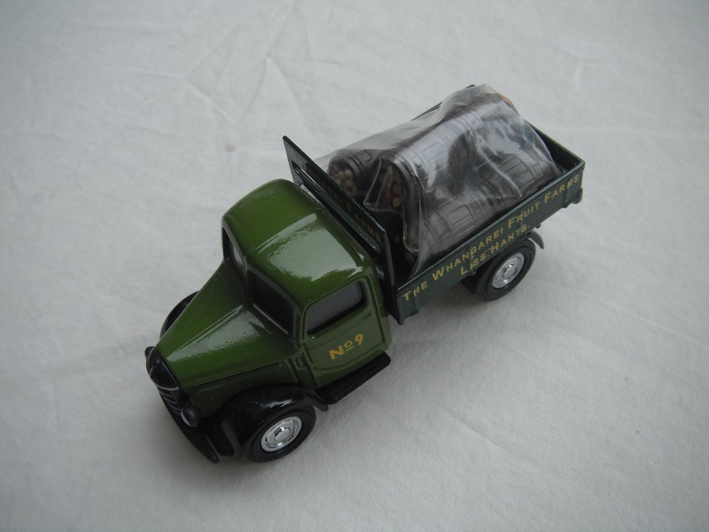 7.  Light green cab/dark green bed/black base/Y63 China/load of apples/No.9.