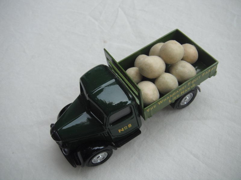 6.  Dark green cab/light green bed/black base/Y63 China/load of melons/No.8.