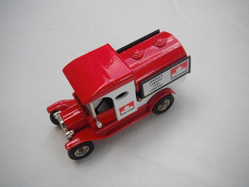 6. Red &amp; white cab/red roof/red tank with side panels/red base/Matchbox England/12 spoke brass wheels/black seat.