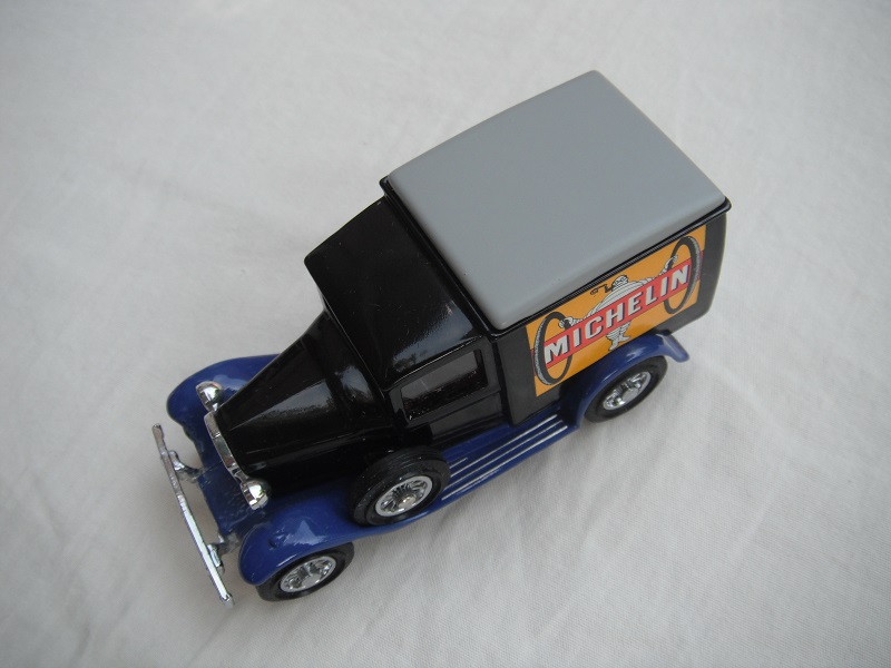 7. Model 'A' van/black body/gray roof/dark blue base/YCH02/2 China/12 spoke chrome wheels/reddish-brown seat.