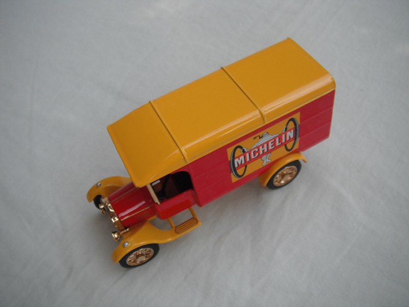 4. Model 'TT' van/red body/yellow roof/yellow base/China/12 spoke gold wheels/black seat.