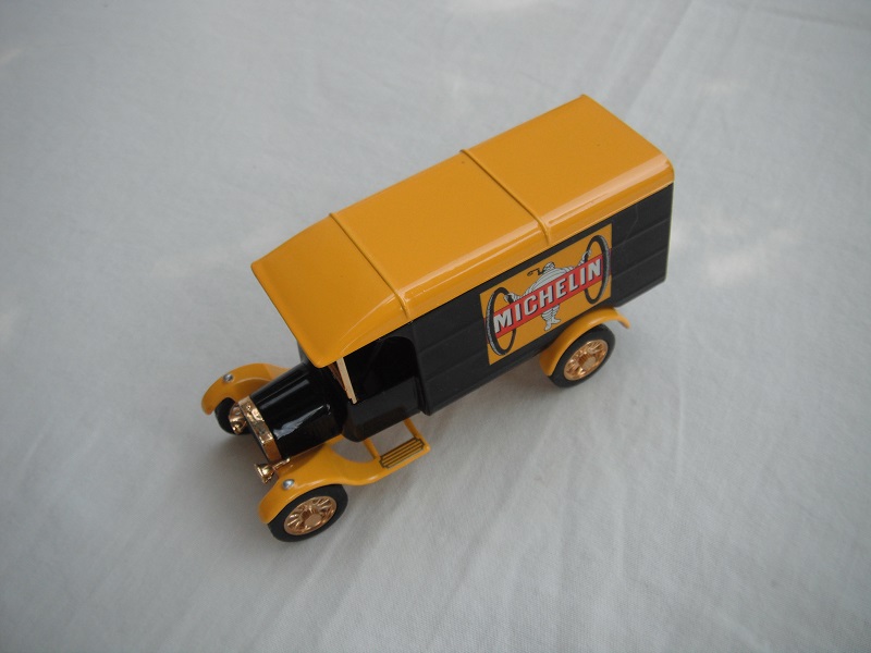 3. Model 'TT' van/black body/yellow roof/yellow base/China/12 spoke gold wheels/black seat.