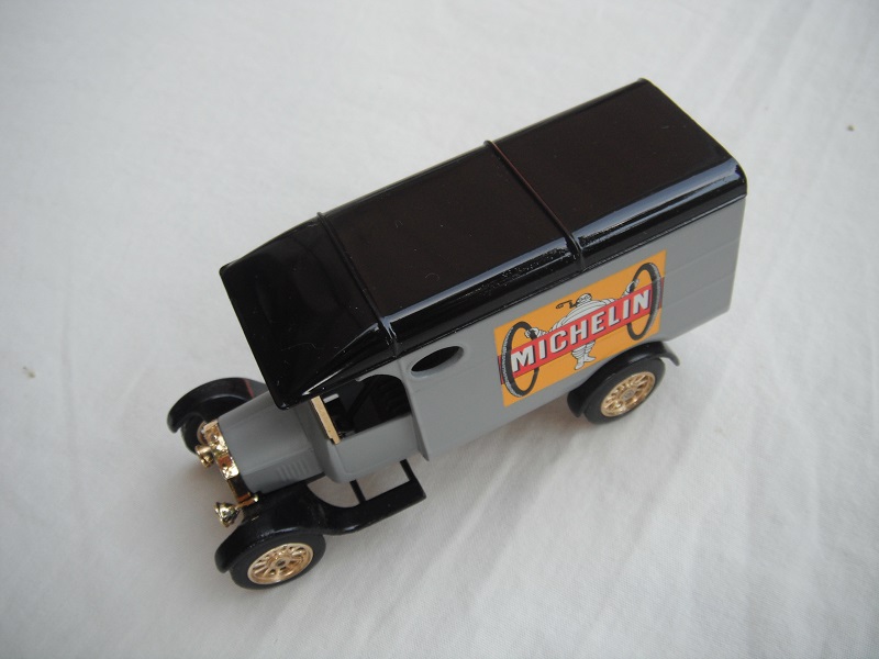 2. Model 'TT' van/gray body/black roof/black base/China/12 spoke gold wheels/gray seat.