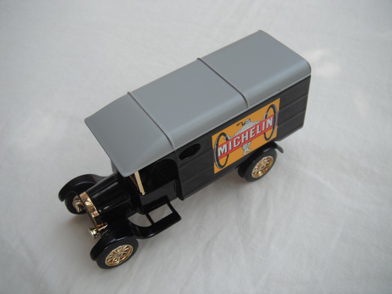 1. Model 'TT' van/black body/gray roof/black base/China/12 spoke gold wheels/gray seat.