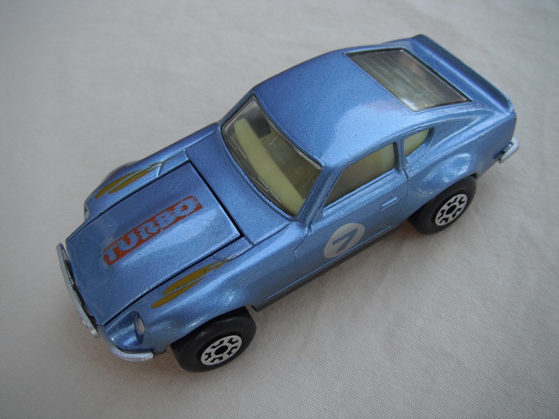 B156. Metallic blue body/charcoal base/light yellow interior/5 crown wheels/&quot;7&quot; on door.