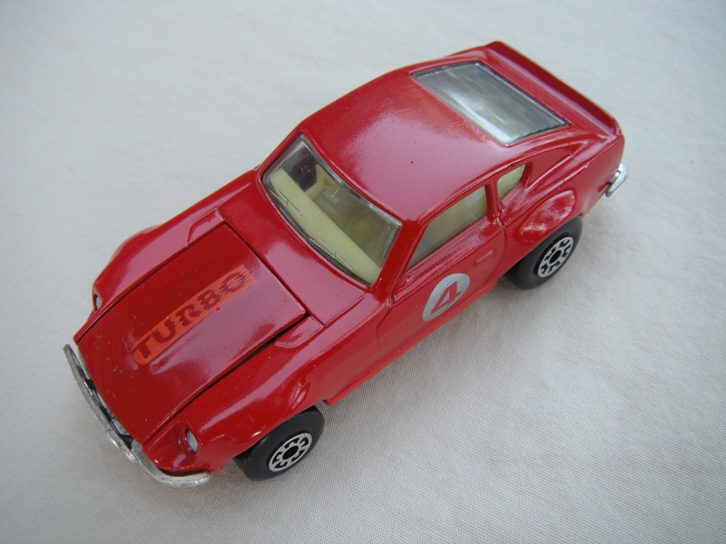 B141. Red body/red base/light yellow interior/5 arch front, 5 crown rear wheels/&quot;4&quot; on door.