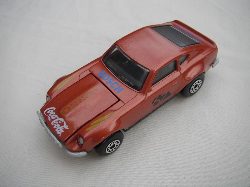B117. Met. brown body/gloss black base/black interior/5 arch front, 5 crown rear wheels/&quot;67&quot; &amp; Turbo Coca Cola on hood/green fenders decals.