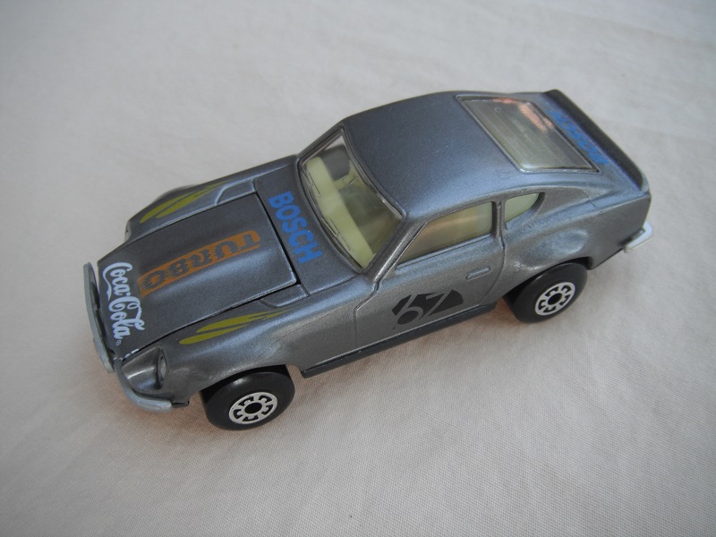 B113. Silver body/gloss black base/lt.yellow interior/5 arch wheels/&quot;67&quot; &amp; Turbo Coca Cola on hood/lt.yellow fender decals.