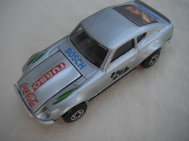 B112. Silver body/gloss black base/black interior/5 arch wheels/&quot;67&quot; &amp; Turbo Coca Cola on hood/green fender decals.