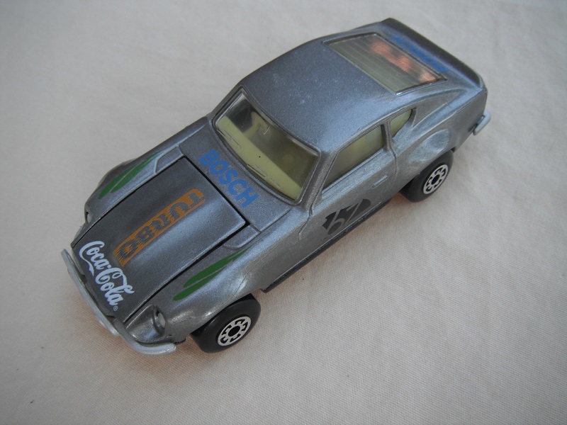 B111. Silver body/gloss black base/lt.yellow interior/5 arch wheels/&quot;67&quot; &amp; Turbo Coca Cola on hood/green fender decals.