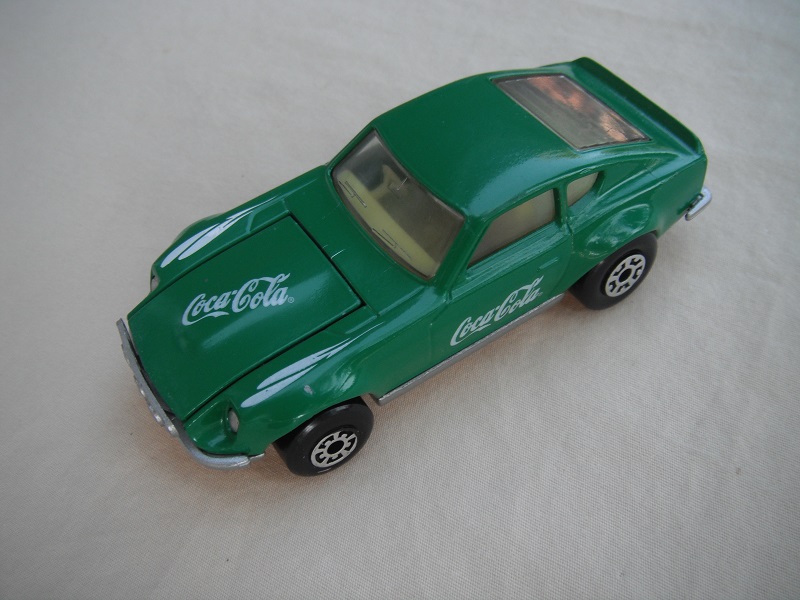 B106. Green body/silver base/light yellow interior/5 arch wheels(large)/Coca Cola decals.