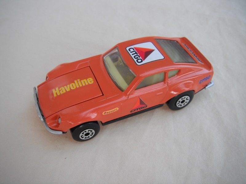 B102. Orange body/black base/light yellow interior/5 arch front, 5 crown rear wheels/Havoline &amp; Citgo decals. decals.