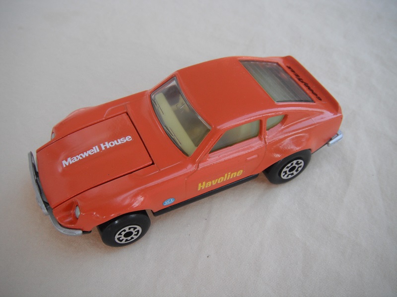 B101. Orange body/black base/light yellow interior/5 arch front, 5 crown rear wheels/Havoline &amp; Maxwell House decals.
