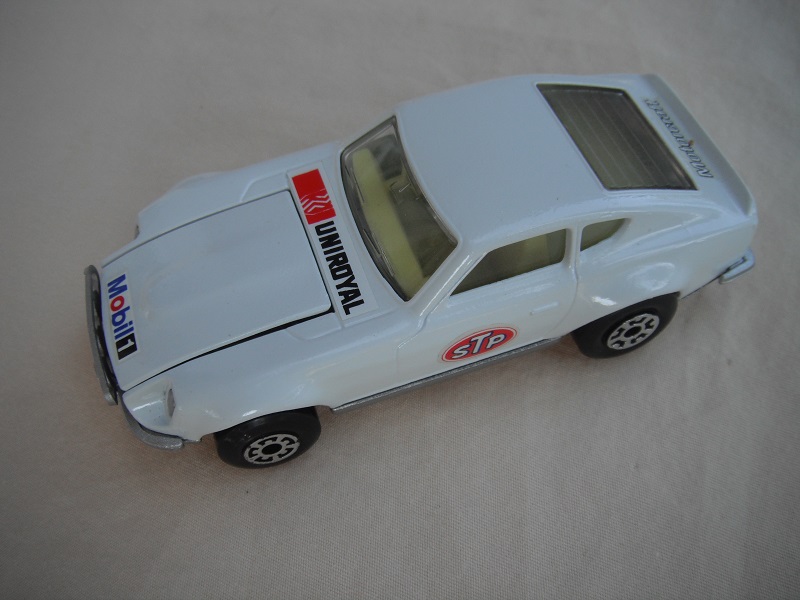 B97. White body/silver base/light yellow interior/5 arch front, 5 crown rear wheels/Mobile/STP/Uniroyal decals.
