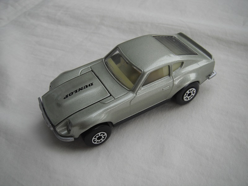 B92. Metallic lt.green body/charcoal base/lt.yellow interior/5 arch front, 5 crown rear wheels/Dunlop on hood decals.