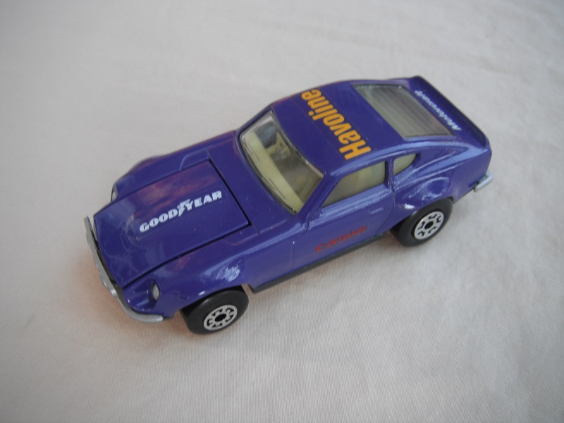 B78. Purple body/charcoal base/light yellow interior/5 arch front, 5 crown rear wheels/Canon decals.