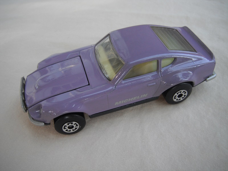 B75. Light purple body/charcoal base/light yellow interior/5 arch front &amp; rear wheels/Michelin decals.