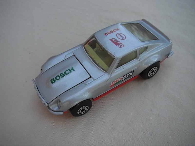 B67. Silver body/red base/light yellow interior/5 arch front, 5 crown rear wheels/Castrol/GTX decals.