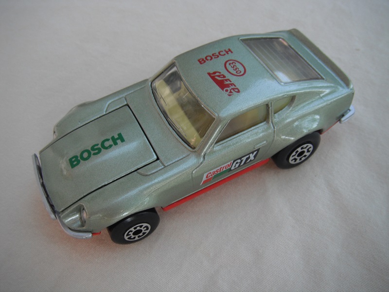 B49. Metallic silver body/red base/light yellow interior/5 arch front, 5 crown rear wheels/Castrol/GTX decals.