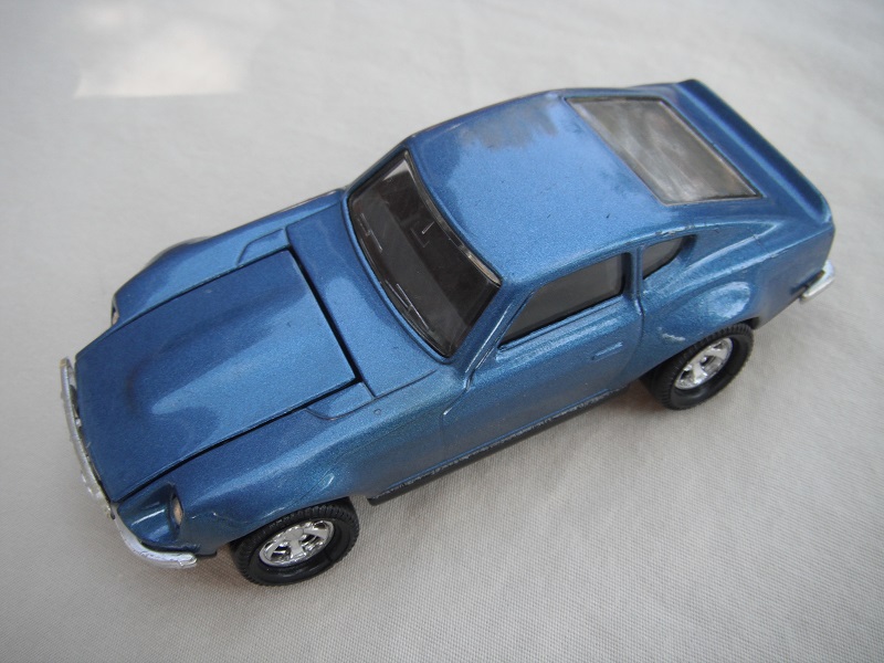 B5. Metallic blue body/black base/black interior/5 spoke mag wheels.