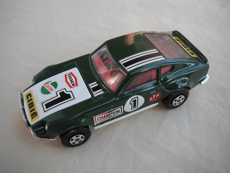 E14.Dk.green body/white hood/white base w/hole/red interior/5 spoke whls/&quot;1 Cibie&quot; decals on hood &amp; sides, stripes on roof/Speedkings.