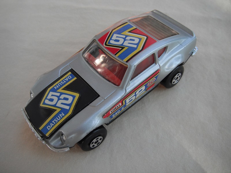 E8. Silver body/black hood/blk base/red int/5 spoke whls/&quot;52 Datsun&quot; labels on hood, red on sides &amp; roof with white outline/Speedkings.
