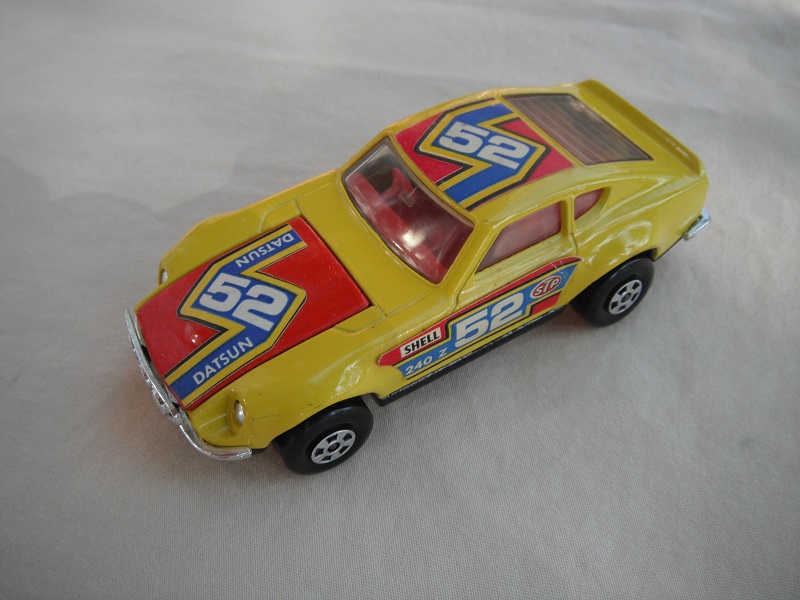 E5. Yellow body/red hood/gloss black base/red interior/5 spoke wheels/&quot;52 Datsun&quot; labels on hood, red on roof &amp; sides/Speedkings.