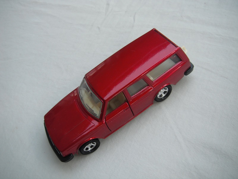 7. Met.red body/black base/Lesney England/Superkings/5SMW/clear windows/chrome outline/cream interior/no roof label.