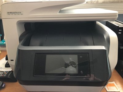 My wife's HP printer that smears everything on glossy paper.