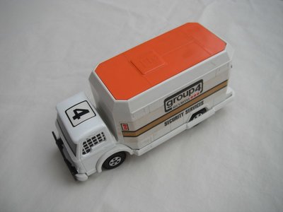 2. White body/orange roof/white base/5 spoke wheels/black axle covers/black windows w/mesh/&quot;Group 4&quot; labels.