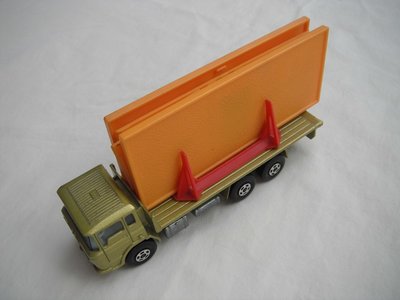 10.Olive green body/unpainted K-13 base/blue tint windows/white int/5 spoke star wheels/blue open axle cover/orange building.