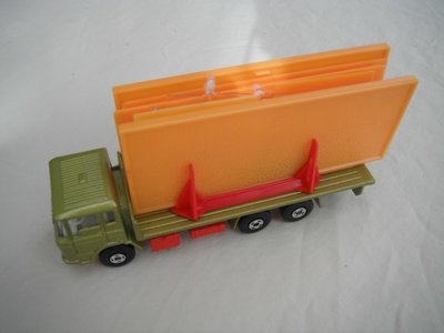 2. Olive green body/red K-13/20 base/clear windows/white int/4 spoke wheels/black open axle cover/orange building.