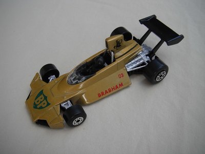 B19.Lt.gold body/black base/dot-dash front, lrg 5 crown rear wheels/black airfoil &amp; driver/&quot;BP&quot;, &quot;Braham 03&quot; &amp; &quot;JPS&quot; decals.