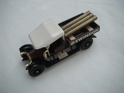 7. Crossley Truck/brown body/cream canopy/black base/Macau/12 spoke black wheels/black seat/brass pipes for load.