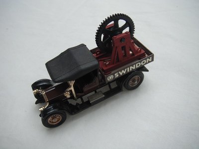 6. Crossley Truck/brown body/black canopy/black base/England/12 spoke brass wheels/black seat/gear wheel &amp; cradle for load.