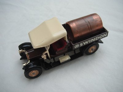 3. Crossley Truck/brown body/cream canopy/black base/England/solid gold wheels/burgundy seat/large copper tube for load.