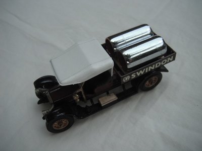 1. Crossley Truck/brown body/white canopy/black base/England/12 spoke brass wheels/black seat/chrome tubes for load.