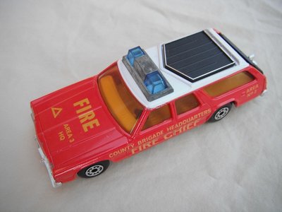 24.Lt.red body/wht roof/red base/Speedkings/dk.grn roof lts/blk roof rack/amb windows/yel int/blk tailgate/Fire Chief.