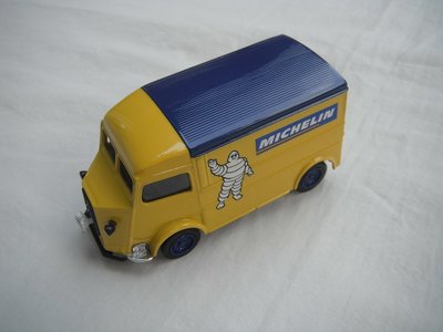 3.  Yellow bonnet/yellow body/blue roof/blue base/China/blue wheels/Michelin figure on radiator grill.