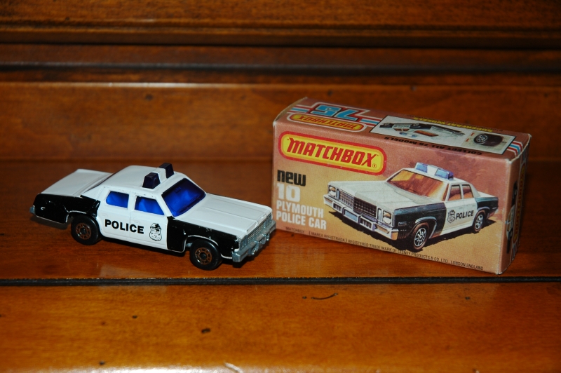 10C_Plymouth Gran Fury Police Car_Police_darkest blue windows and lights_dd wheels_unpainted base Lesney_G_L-Box new.jpg
